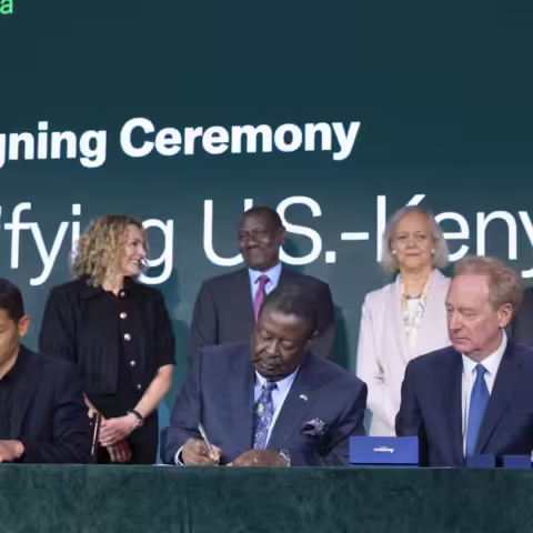 CEO Peng Xiao of G42, Secretary Musalia Mudavadi of Kenya, and Microsoft Vice Chair Brad Smith sign an initial investment of $1 billion for a comprehensive digital ecosystem in Kenya