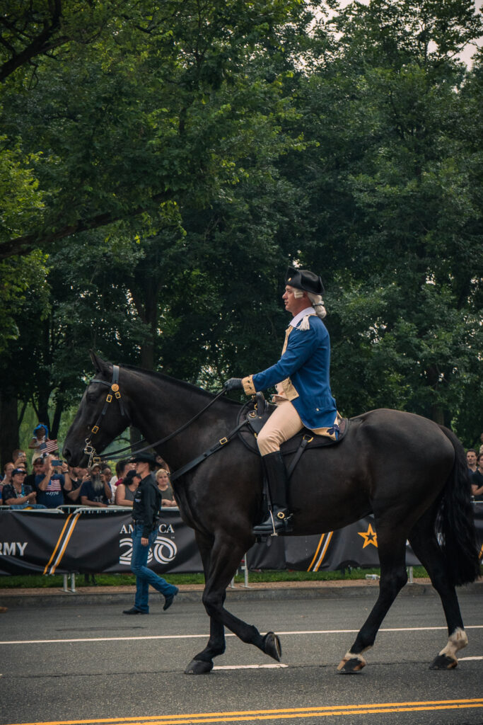 A soldier in Revolutionary War uniform leads a division representing the American soldiers from the war during the military parade commemorating the Army’s 250th anniversary and coinciding with President Donald Trump’s 79th birthday, Saturday, June 14, in Washington. Photo by Hannah Parcells.