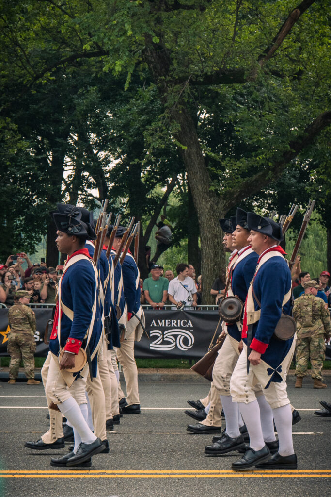 Soldiers dressing in Revolutionary War uniform march in the military parade commemorating the Army’s 250th anniversary and coinciding with President Donald Trump’s 79th birthday, Saturday, June 14, in Washington. Photo by Hannah Parcells.
