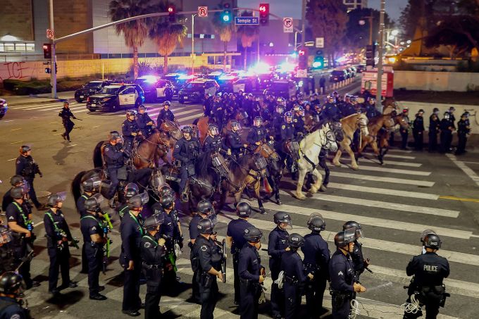 Police move to enforce an 8 p.m. curfew in downtown Los Angeles, after it went into effect on Tuesday, June 10. Mayor Karen Bass declared a curfew for the 1 square mile in which protests have been centered. Mario Tama/Getty Images