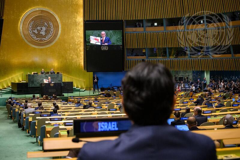 Benjamin Netanyahu (at podium and on screen), Prime Minister of the State of Israel, addresses the general debate of the General Assembly's eightieth session. In the foreground is Danny Danon, Permanent Representative of Israel to the United Nations