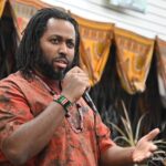 Dr. Obari Cartman celebrates Kwanzaa at Mama Africa’s marketplace in Chicago, Illinois. Source: Manford Holmes 